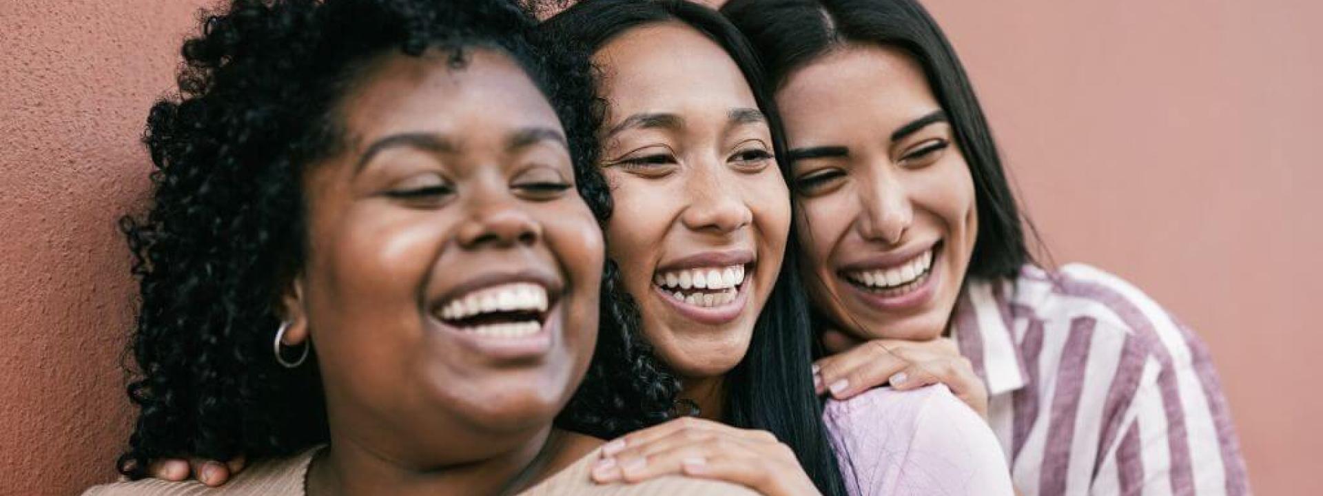 Group of young women smiling together 
